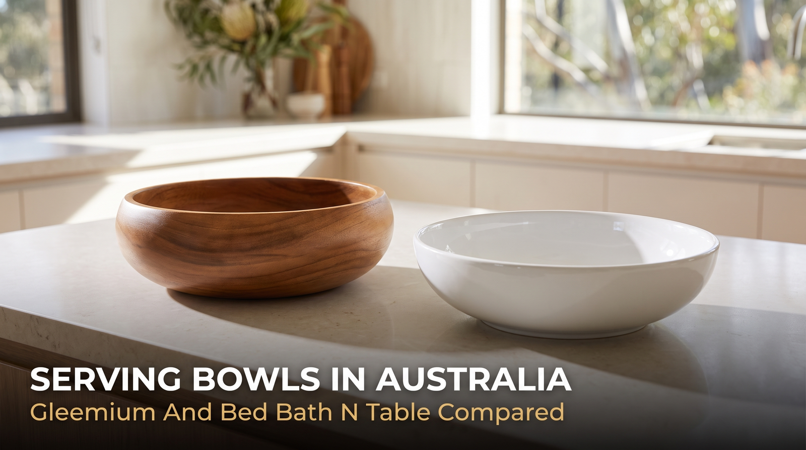 A hand-turned wooden serving bowl beside a glazed white ceramic serving bowl on a kitchen benchtop
