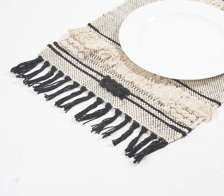 Neutral tasseled placemats with tableware