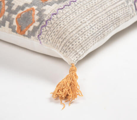 Printed embroidered lumbar cushion cover paired with other cushions