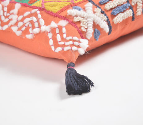 Tangerine embroidered cushion cover in a colourful room