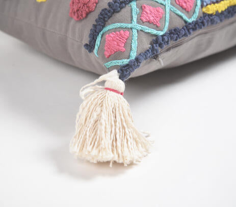 Diamond embroidered lumbar cushion cover styled on a bed