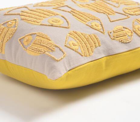 Fish embroidered cushion cover styled on a bed