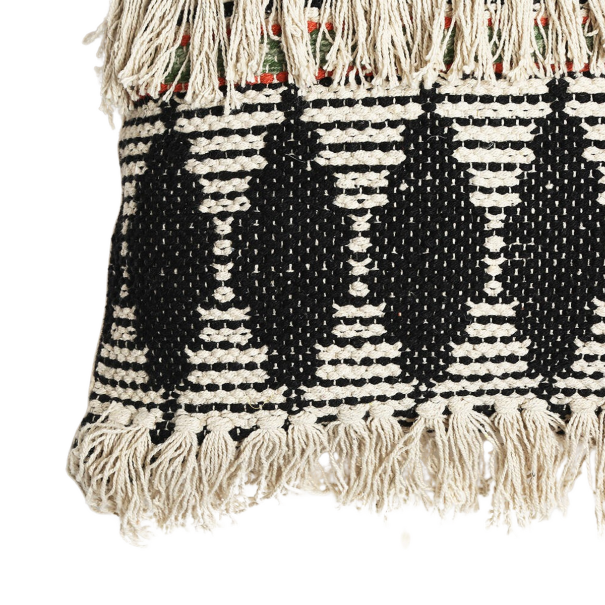 Textured tassel cushion cover on a chair
