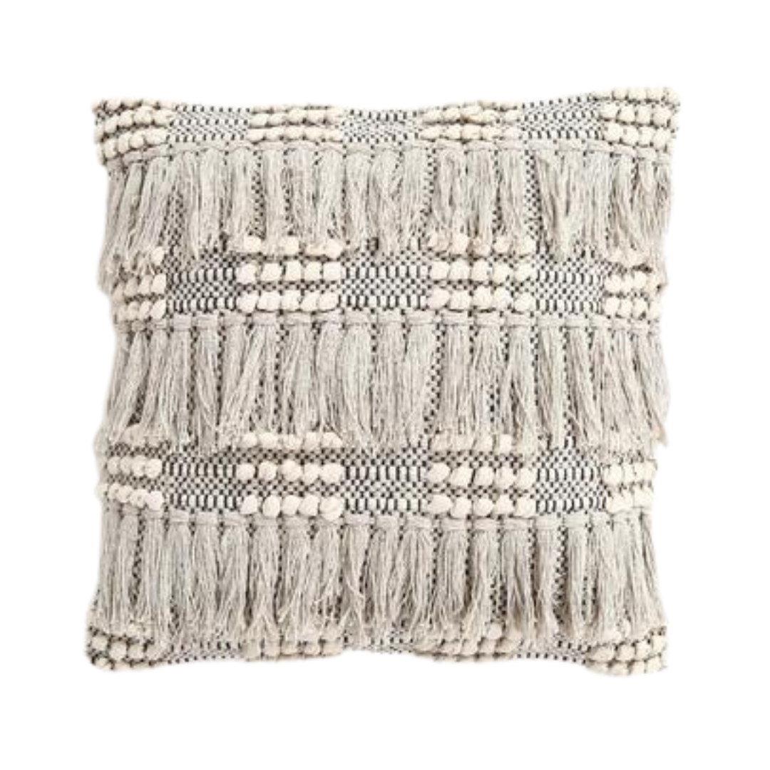 White tufted cushion cover paired with other cushions