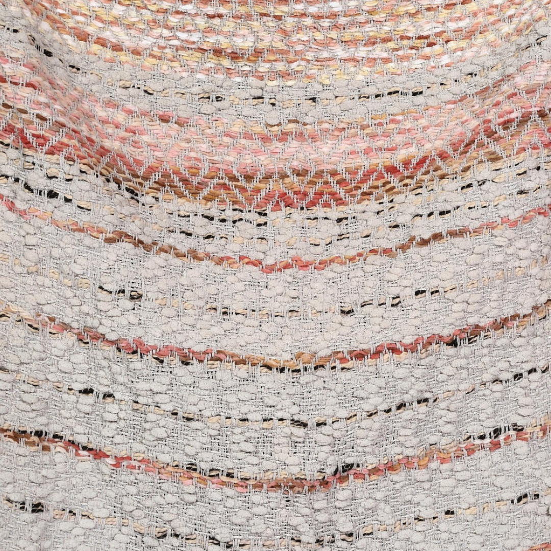 Tufted throw blanket paired with cushions