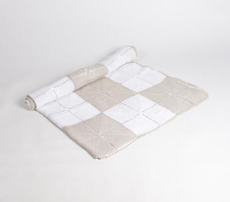 Crochet throw blanket paired with cushions