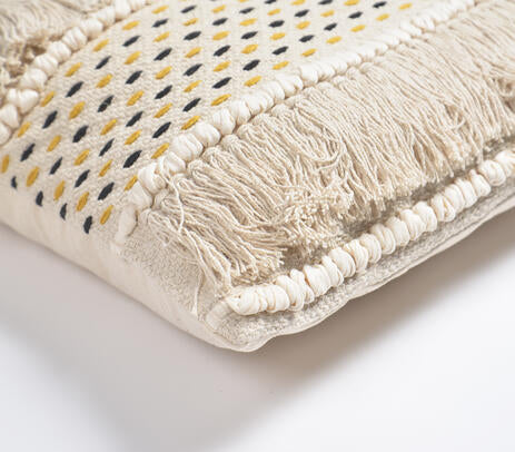 White fringed cushion cover paired with other cushions