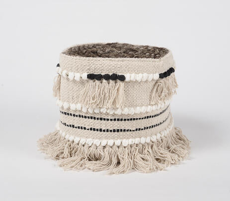 Fringed cotton basket styled in a room