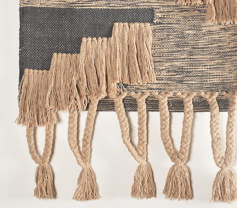Braided cotton wall hanging shown over a hallway console
