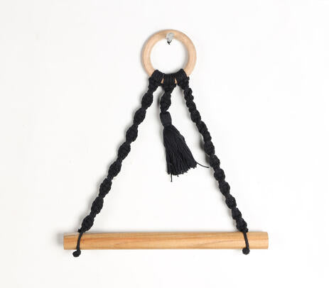 Black macrame toilet roll holder side view