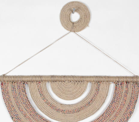 Jute and cane wall decor above a console table