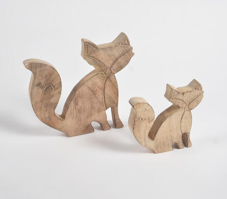Wooden fox figurines side view