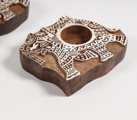 Hand carved elephant holders angled product shot