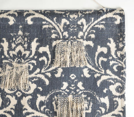 Damask patchwork wall hanging styled grouped with other boho textiles