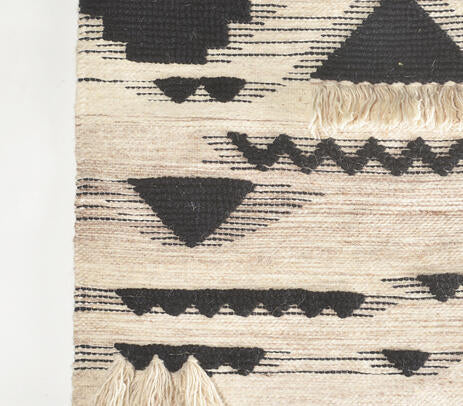 Tribal wool wall hanging shown with hanging rod detail