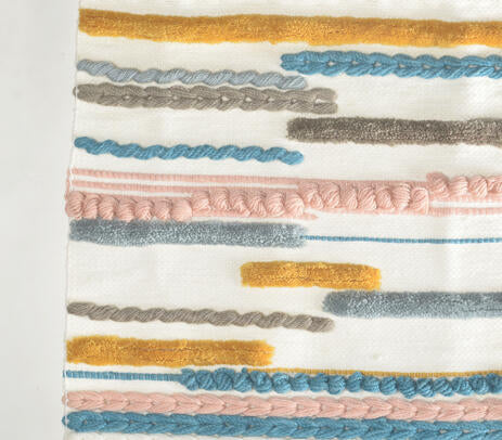 Broken lines wool wall hanging above a sofa