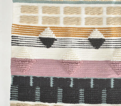 Wool tapestry wall hanging detail of geometric weave