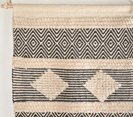Handwoven geometric cotton wall hanging shown with hanging rod detail