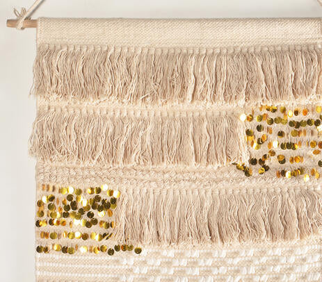 Sequin cotton wall hanging shown grouped in a layered gallery wall