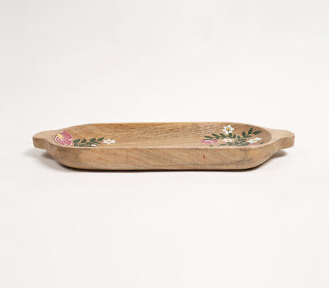Elongated wood platter paired with tableware