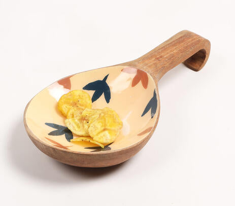 Enamelled wood platter paired with tableware
