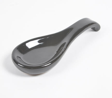 Ceramic spoon rest paired with utensils