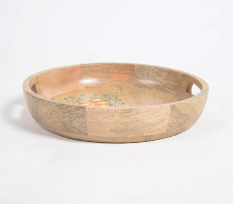 Round mango wood tray paired with tableware