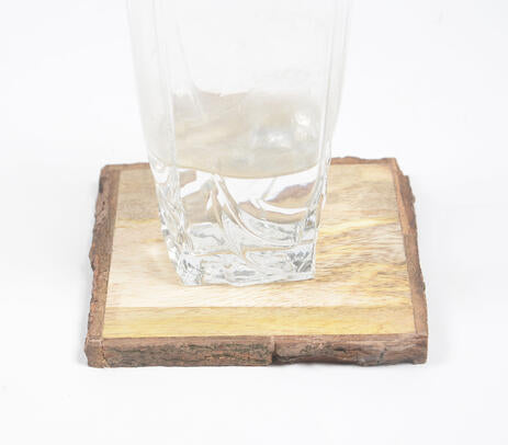 Wooden bark coasters paired with tableware