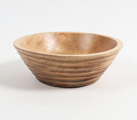 Burnt wood bowl paired with tableware