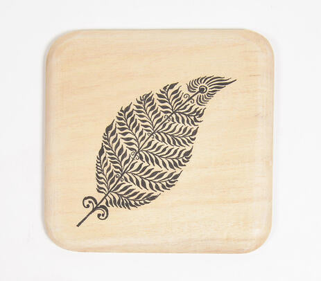 Feather wooden coasters paired with tableware