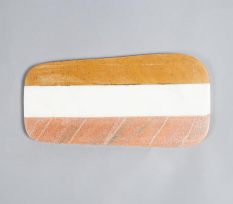 Striped marble cheeseboard styled on table