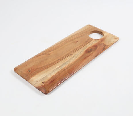 Classic acacia chopping board paired with kitchen items