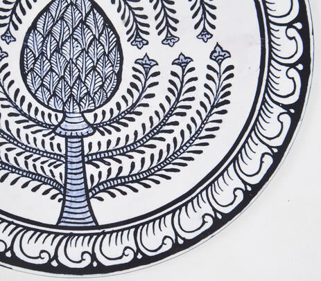 Tribal trivet paired with kitchen items