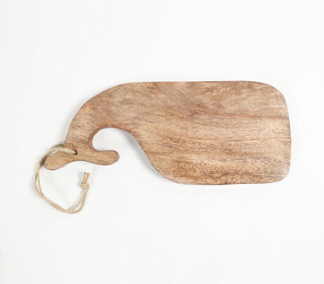 Mango wood chopping board paired with kitchen items