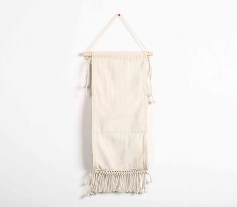Macrame wine rack with three bottles