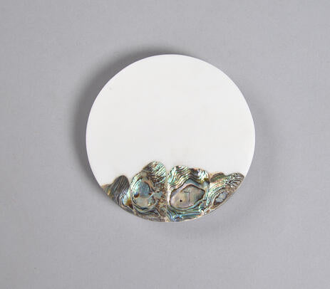 Abalone shell coasters paired with tableware