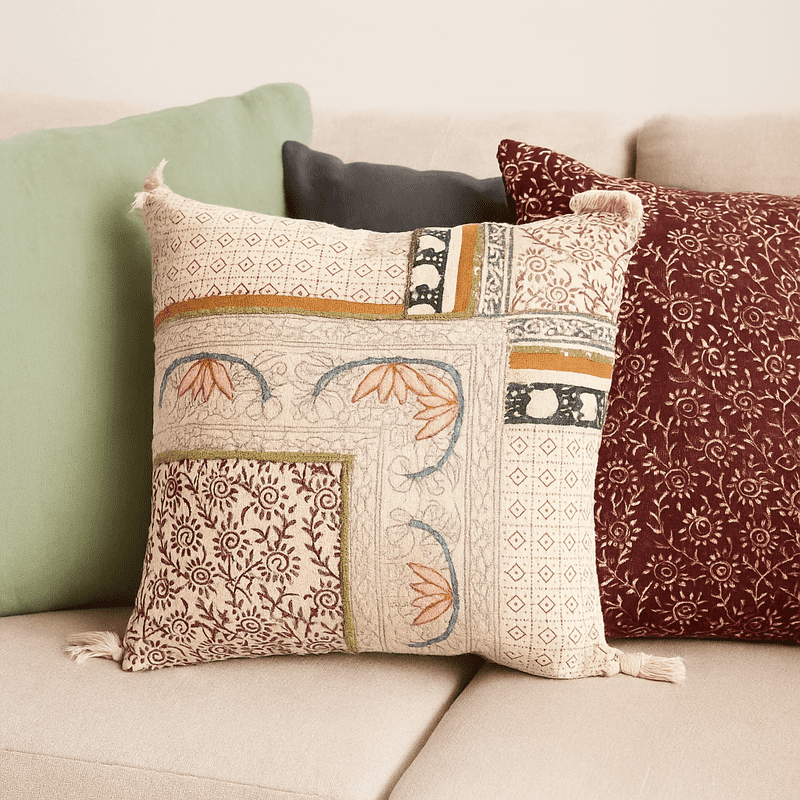 Geometric floral cushion cover on a styled chair