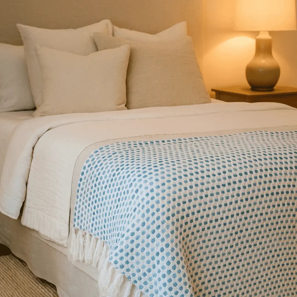 Blue dots throw blanket draped over a chair