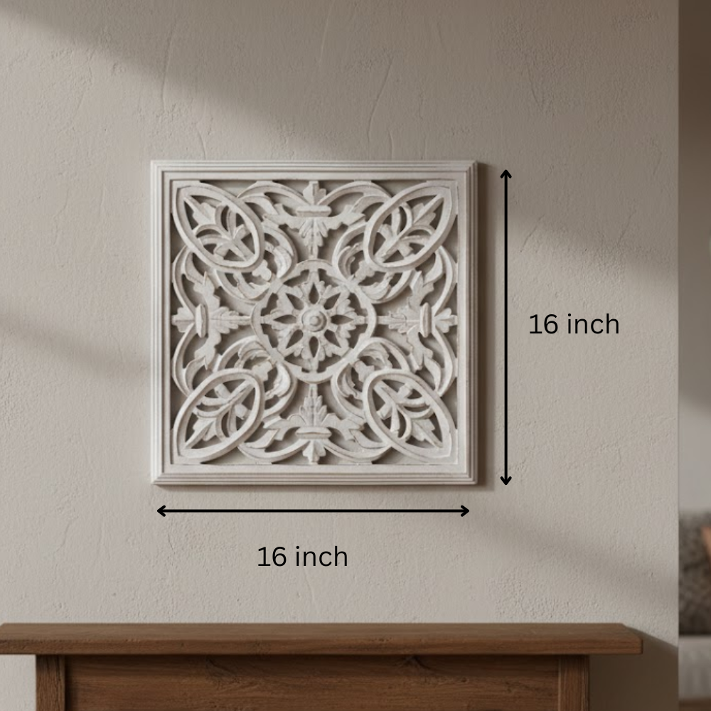 White distressed wall plaque on a plain wall