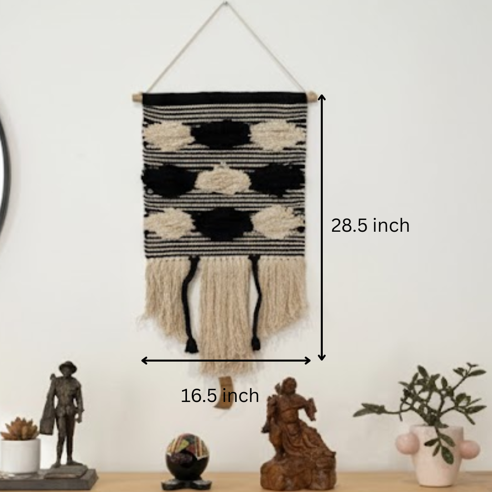 Black and cream striped cotton wall hanging shown over a modern sofa