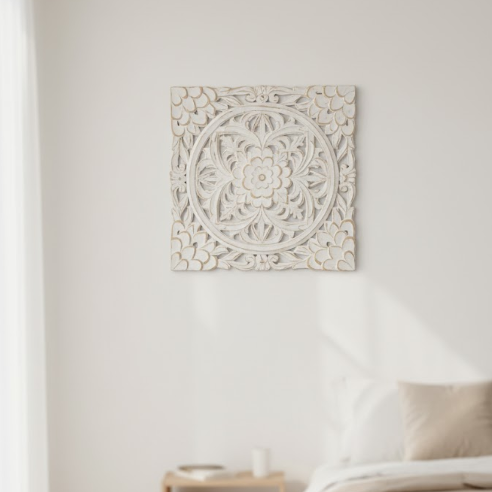 Floral medallion wall plaque detail of distressed white paint