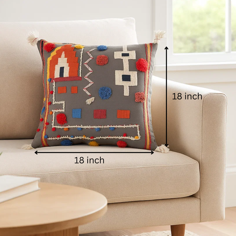 Abstract embroidered cushion cover styled on a sofa