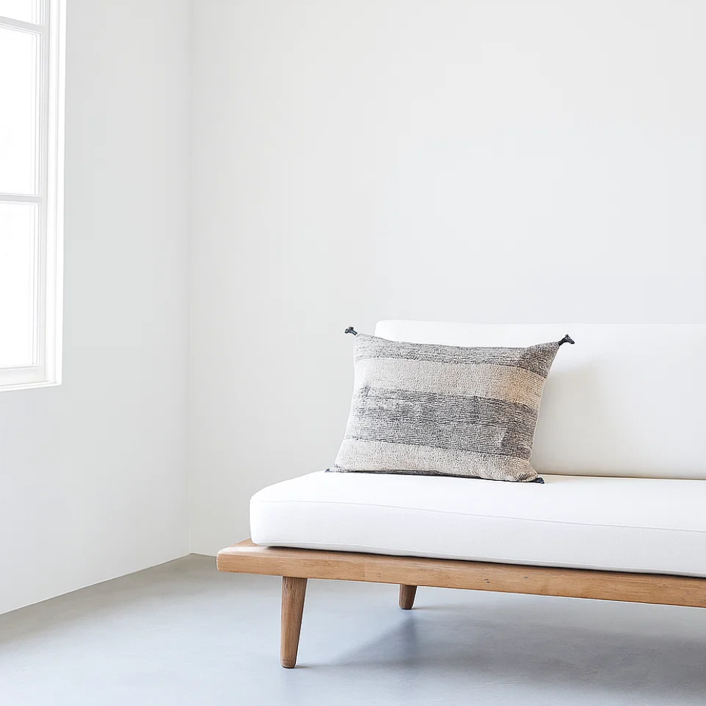Black lumbar cushion cover styled on a sofa