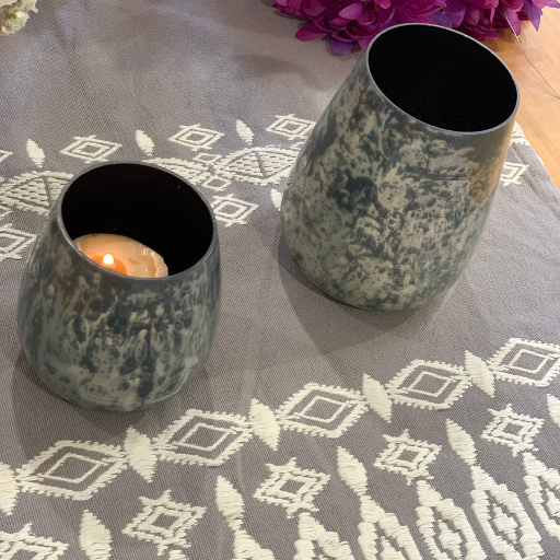 Monochrome glass votives close-up of textured surface