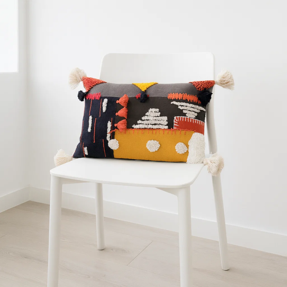 Grey embroidered lumbar cushion cover detail of tassels