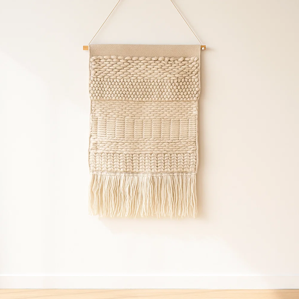 Boho wool fringe wall hanging shown at an angle