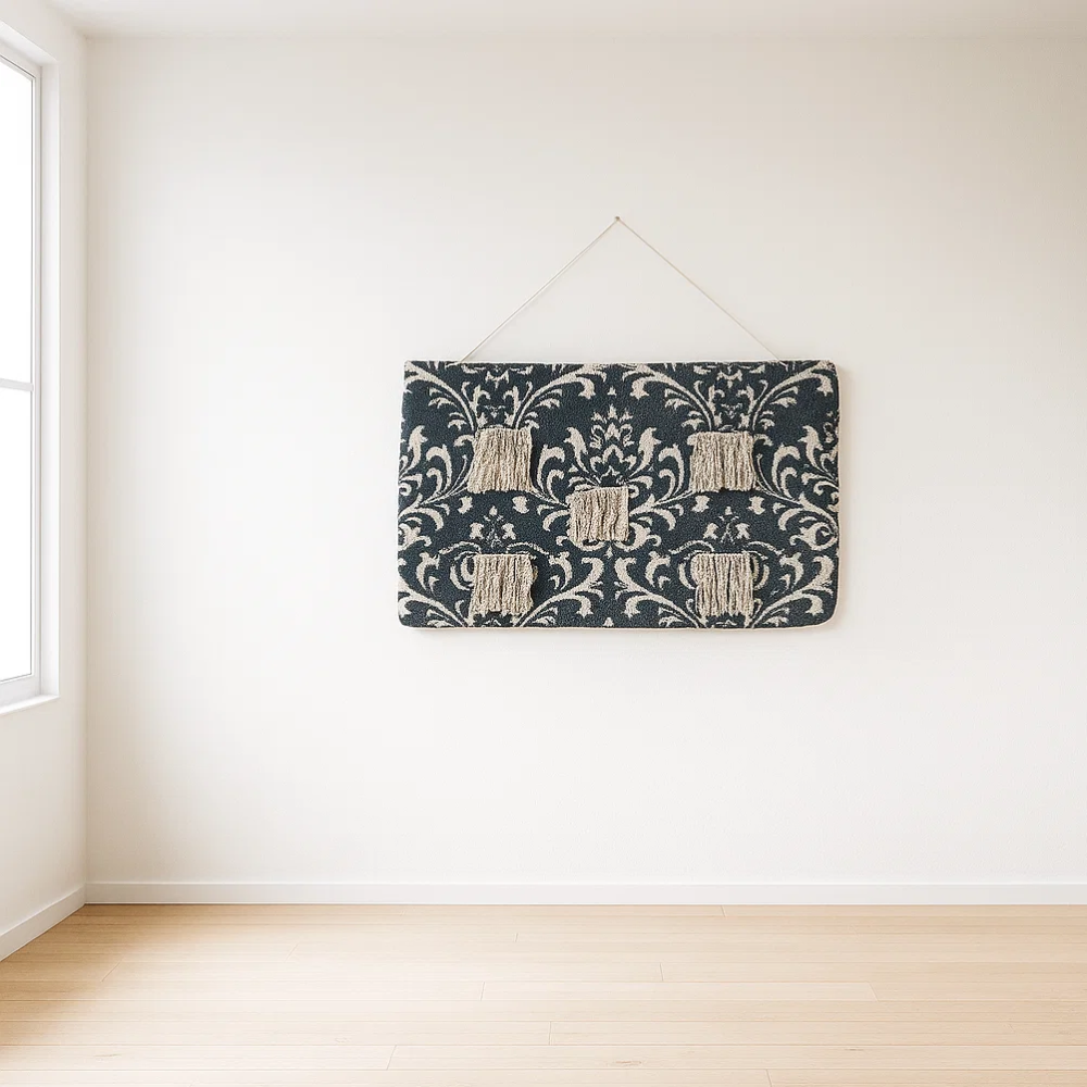 Damask patchwork wall hanging detail of fringed lower edge
