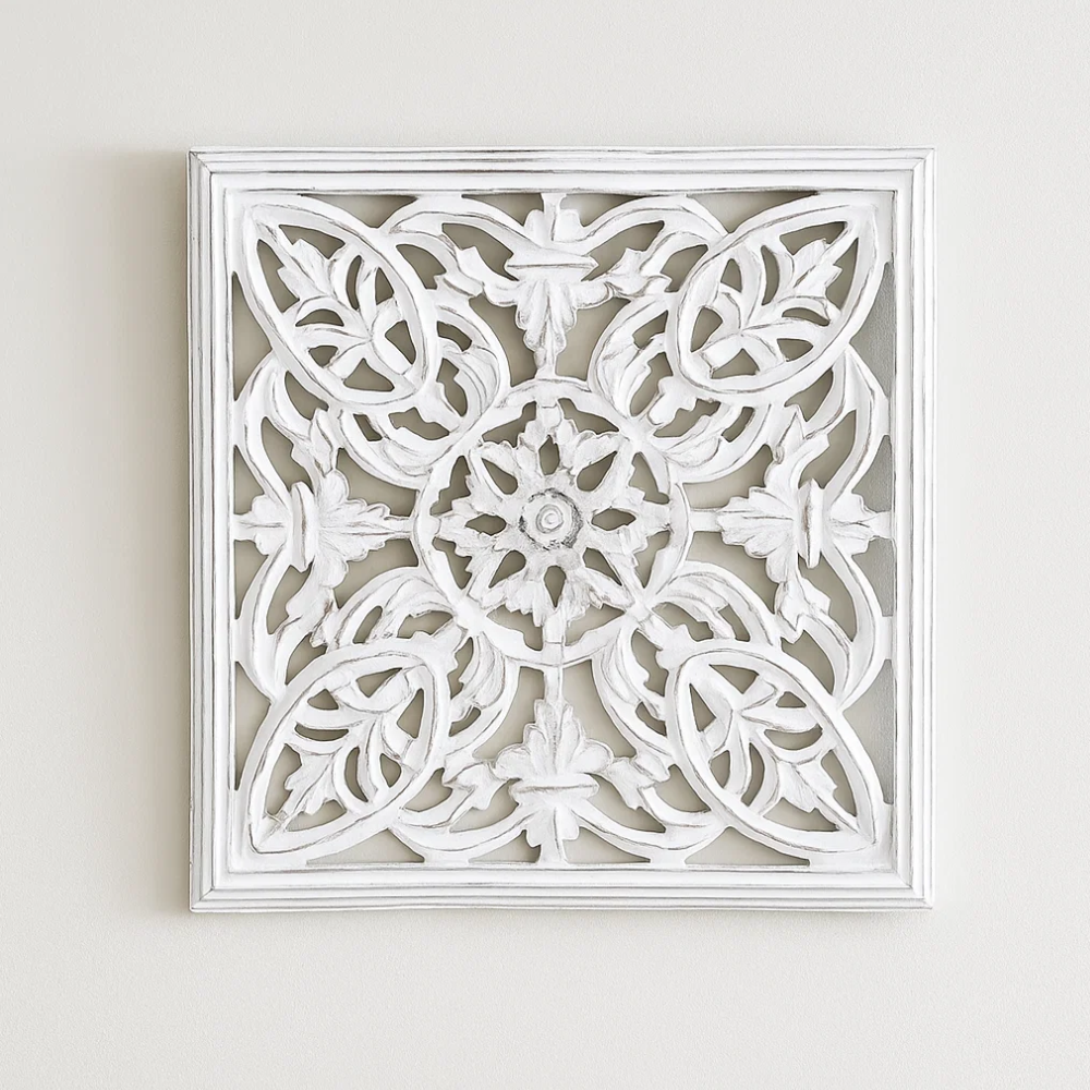 White distressed wall plaque detail of cream tones in the carving