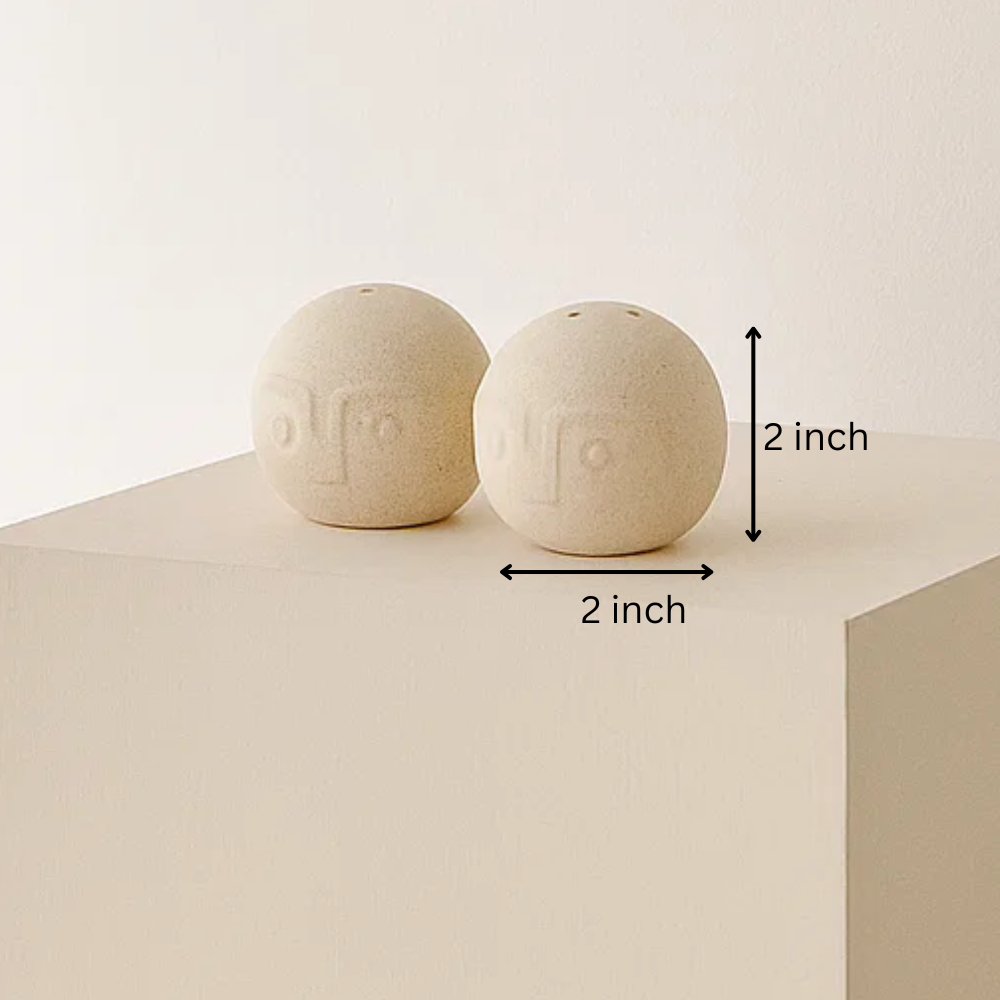 Ceramic salt pepper shakers styled on a table