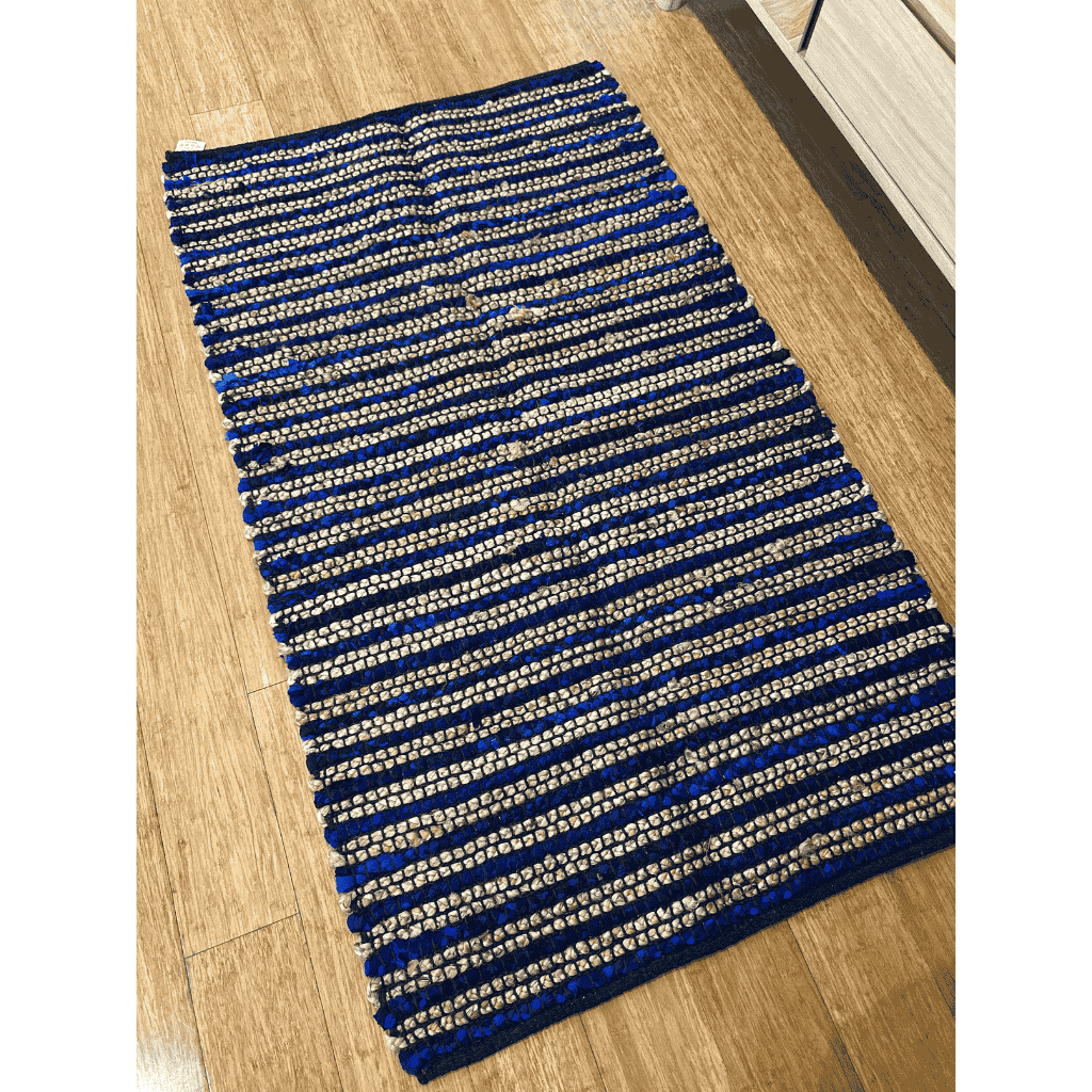 Overhead view of the striped jute rug laid flat